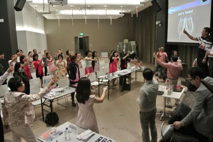 Members raising glasses to toast