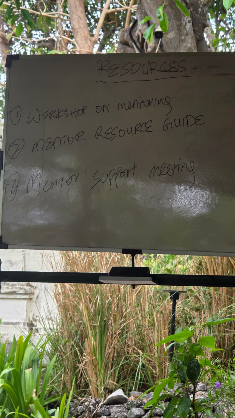 A whiteboard with mentor strategy notes from the retreat